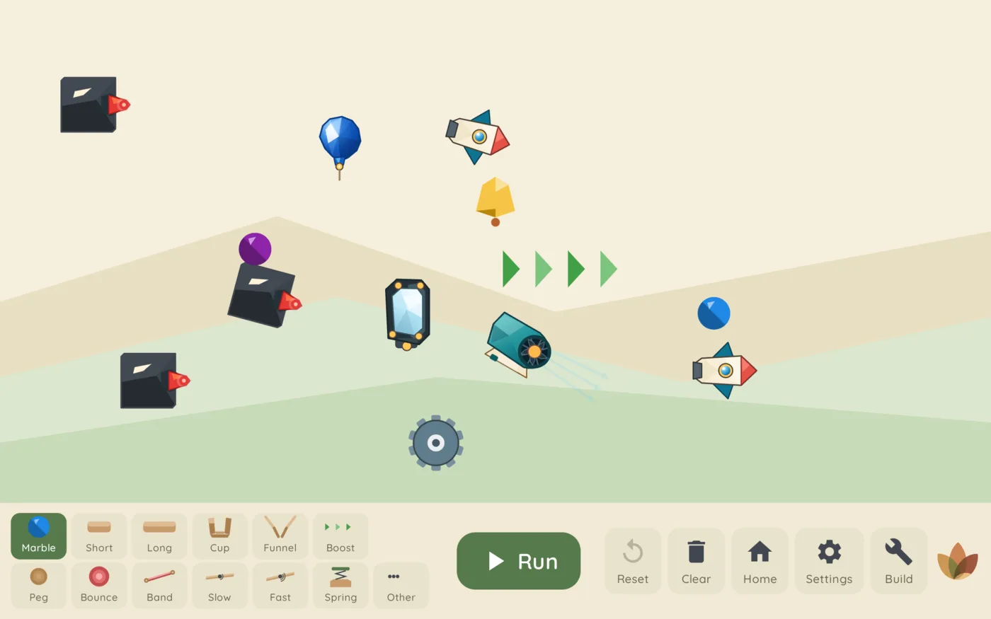 A Sapling Machines marble run using ramps, gears, fans, rockets, and other physics tools
